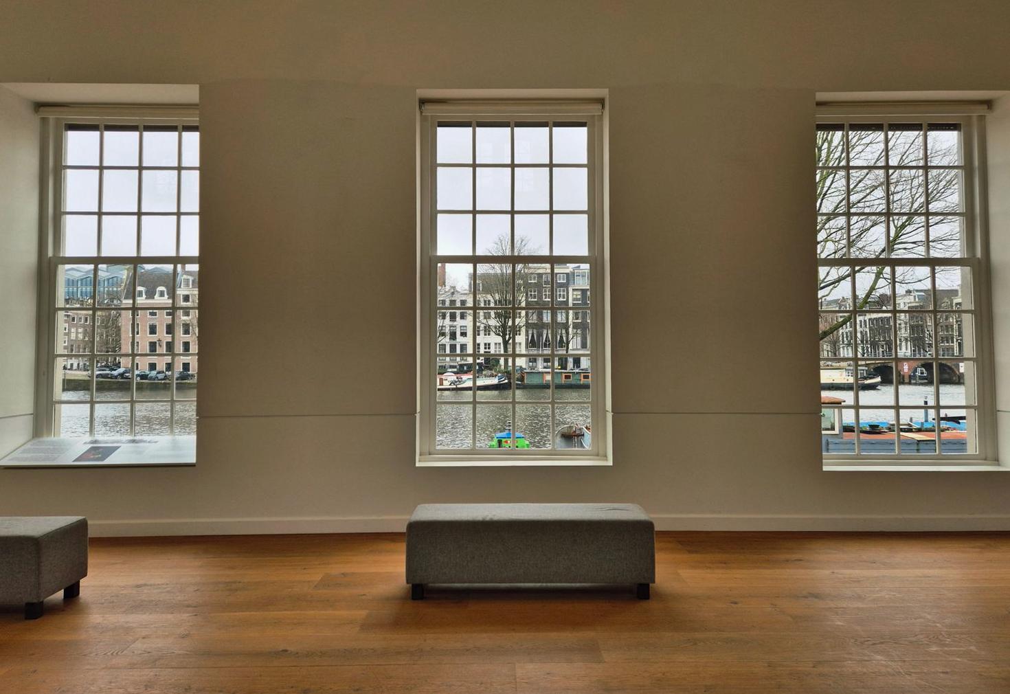 View of Amsterdam canal through a large window